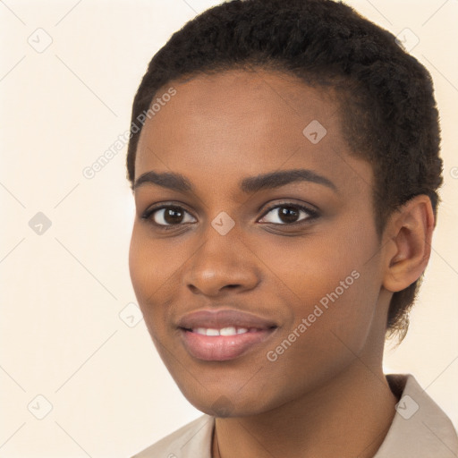 Joyful black young-adult female with short  brown hair and brown eyes