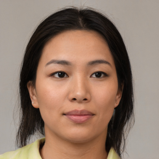 Neutral asian young-adult female with medium  brown hair and brown eyes