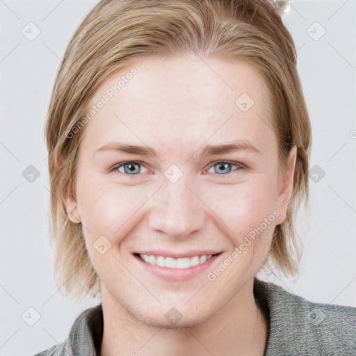 Joyful white young-adult female with medium  brown hair and blue eyes