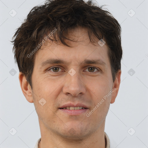 Joyful white adult male with short  brown hair and brown eyes