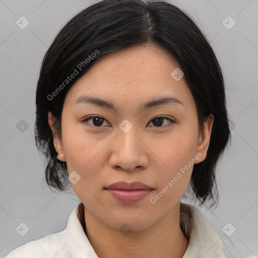 Joyful asian young-adult female with medium  black hair and brown eyes