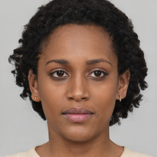 Neutral black young-adult female with short  black hair and brown eyes