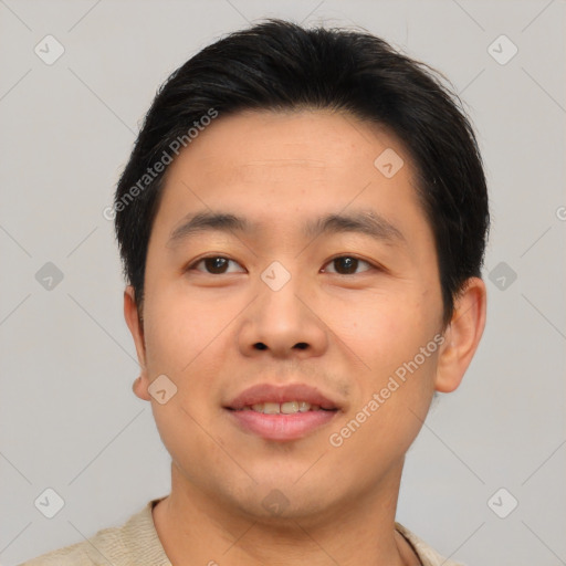 Joyful asian young-adult male with short  brown hair and brown eyes