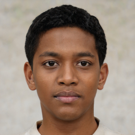 Neutral black child male with short  black hair and brown eyes
