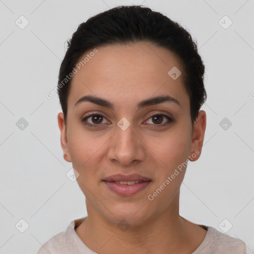 Joyful latino young-adult female with short  brown hair and brown eyes