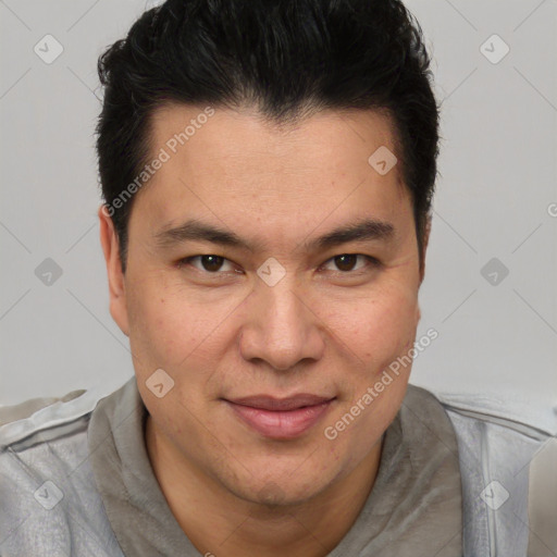 Joyful latino adult male with short  brown hair and brown eyes