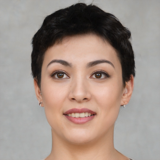 Joyful white young-adult female with short  black hair and brown eyes
