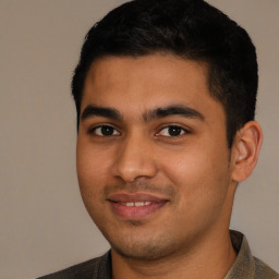 Joyful white young-adult male with short  black hair and brown eyes