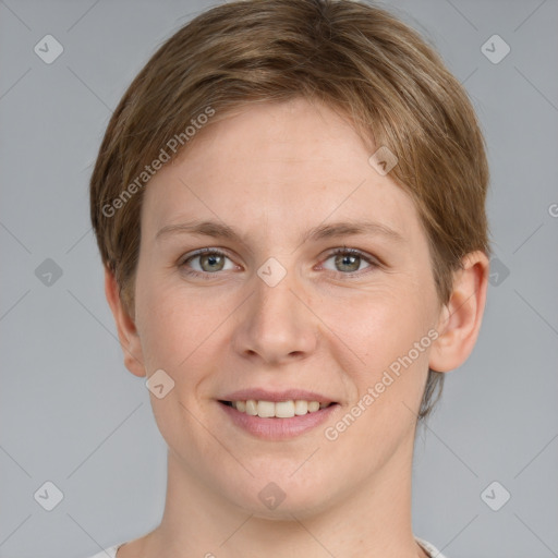 Joyful white young-adult female with short  brown hair and grey eyes