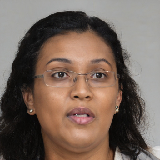 Neutral asian adult female with long  brown hair and brown eyes