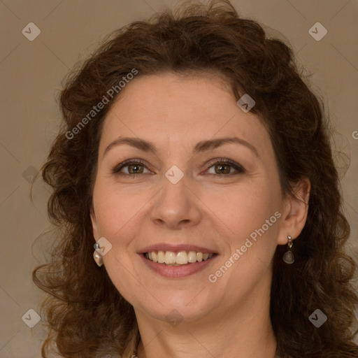 Joyful white adult female with long  brown hair and brown eyes