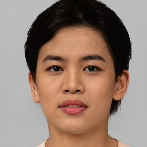 Joyful asian young-adult female with short  black hair and brown eyes