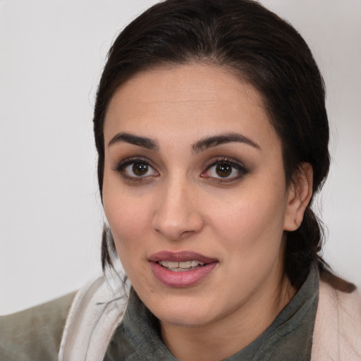 Joyful white young-adult female with medium  brown hair and brown eyes