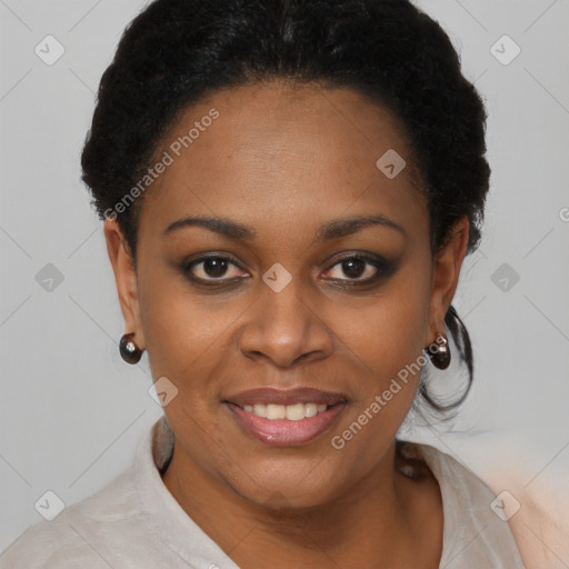 Joyful black young-adult female with short  black hair and brown eyes