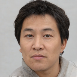 Neutral asian adult male with short  brown hair and brown eyes