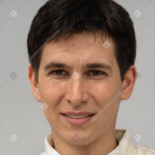 Joyful white adult male with short  brown hair and brown eyes