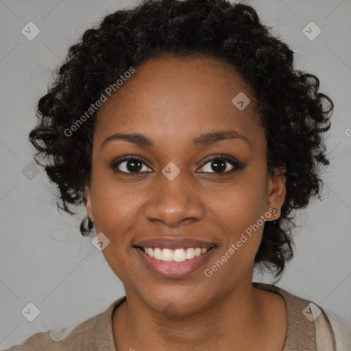 Joyful black young-adult female with medium  black hair and brown eyes