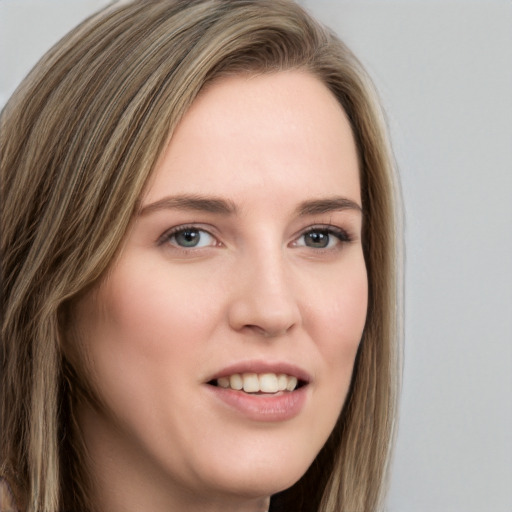 Joyful white young-adult female with long  brown hair and brown eyes