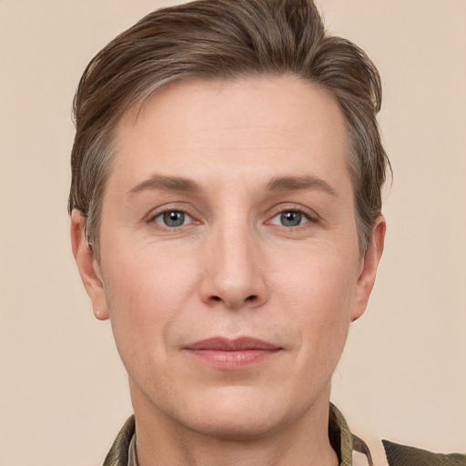 Joyful white adult male with short  brown hair and grey eyes