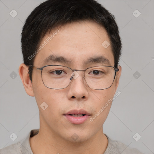 Neutral asian young-adult male with short  brown hair and brown eyes