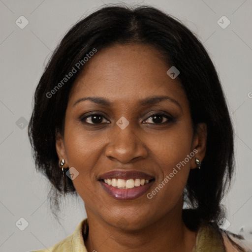 Joyful black young-adult female with medium  brown hair and brown eyes