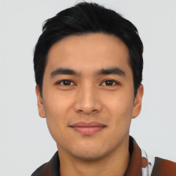 Joyful asian young-adult male with short  black hair and brown eyes