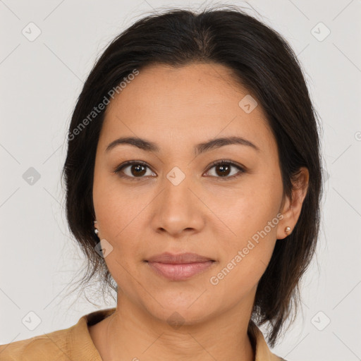 Joyful latino young-adult female with medium  brown hair and brown eyes