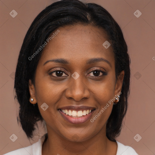 Joyful black young-adult female with long  brown hair and brown eyes