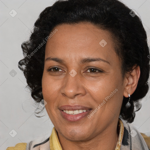 Joyful latino adult female with medium  brown hair and brown eyes