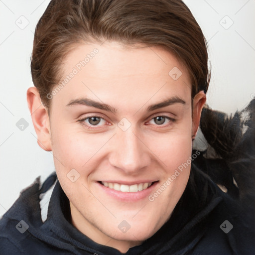 Joyful white young-adult female with short  brown hair and grey eyes