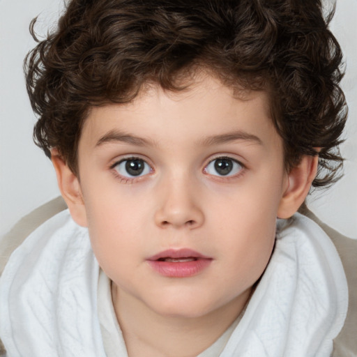 Joyful white child male with short  brown hair and brown eyes