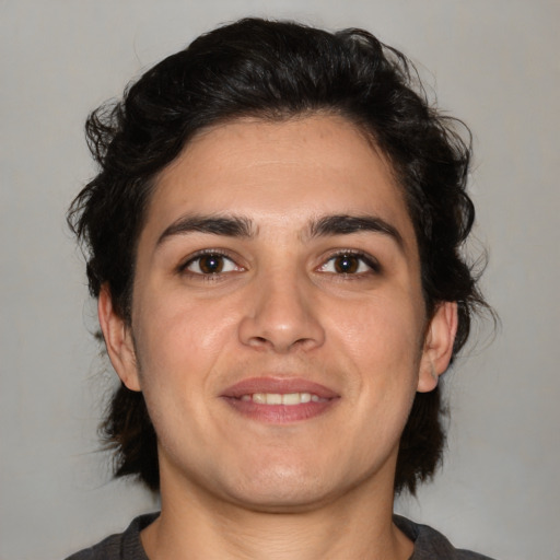 Joyful white young-adult male with medium  brown hair and brown eyes