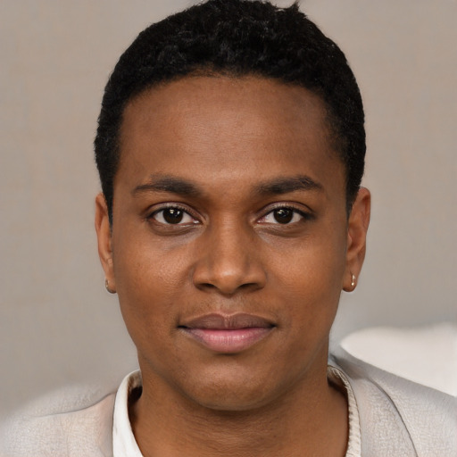 Joyful black young-adult male with short  black hair and brown eyes