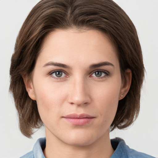 Neutral white young-adult female with medium  brown hair and grey eyes