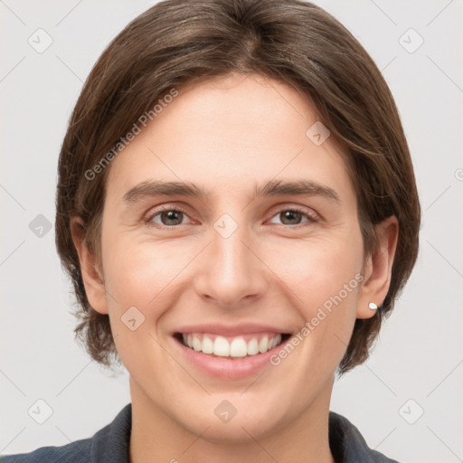 Joyful white young-adult female with medium  brown hair and grey eyes