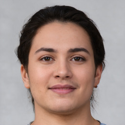 Joyful white young-adult female with medium  brown hair and brown eyes