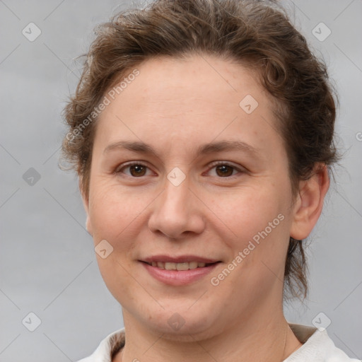 Joyful white adult female with short  brown hair and brown eyes