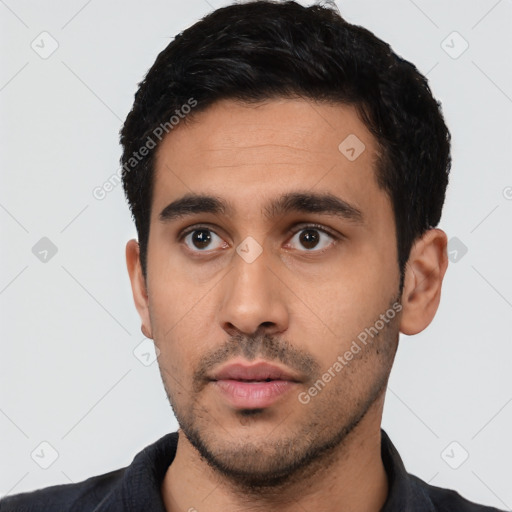 Neutral latino young-adult male with short  black hair and brown eyes