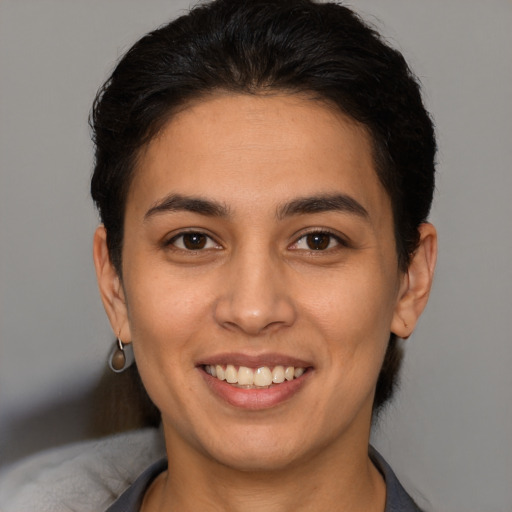 Joyful white young-adult female with short  brown hair and brown eyes