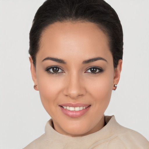 Joyful latino young-adult female with short  brown hair and brown eyes