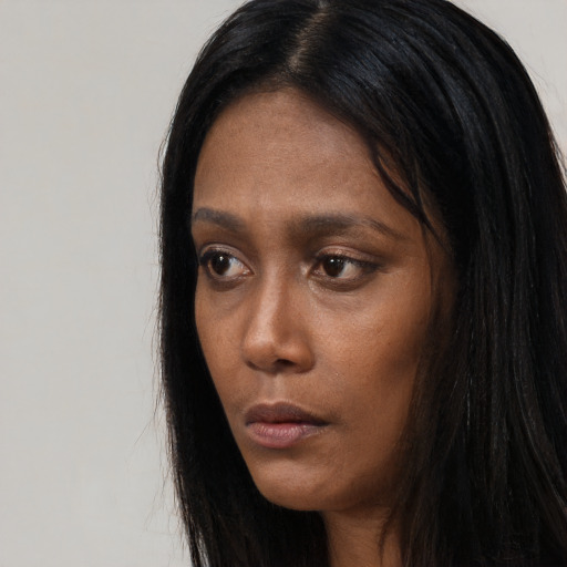 Neutral black young-adult female with long  black hair and brown eyes