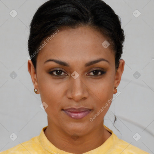 Joyful black young-adult female with short  brown hair and brown eyes