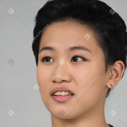 Joyful asian young-adult female with medium  black hair and brown eyes