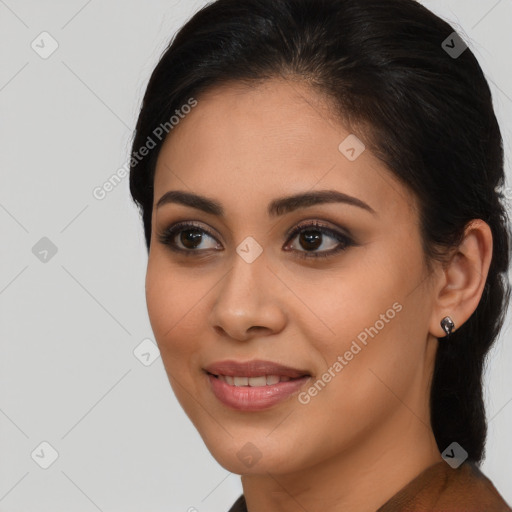 Joyful latino young-adult female with long  brown hair and brown eyes