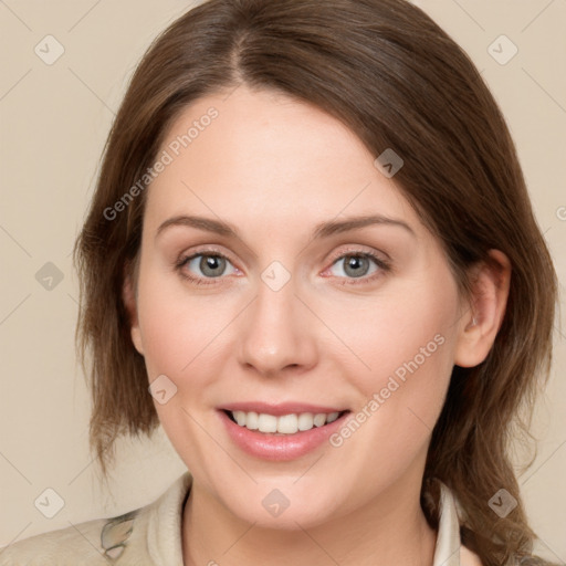 Joyful white young-adult female with medium  brown hair and green eyes