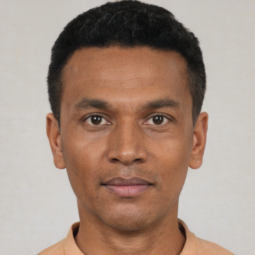 Neutral black young-adult male with short  black hair and brown eyes