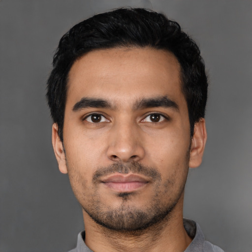 Neutral latino young-adult male with short  black hair and brown eyes