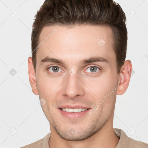 Joyful white young-adult male with short  brown hair and brown eyes