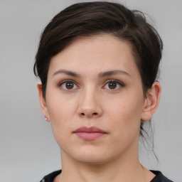 Neutral white young-adult female with short  brown hair and brown eyes