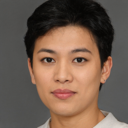 Joyful asian young-adult female with short  black hair and brown eyes